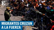 Cientos de migrantes cruzan a la fuerza en puente fronterizo entre Ciudad Juárez y El Paso