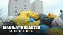 Garbage piles up in French city as rubbish collectors strike
