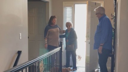 Grandma's face glitters with joy after walking into her very 1st surprise birthday party