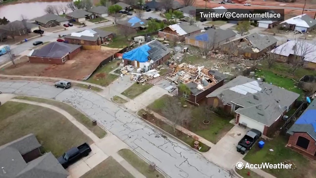 Multiple homes covered in blue tarps in tornado recovery