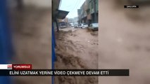 Elini uzatmak yerine video çekmeye devam etti