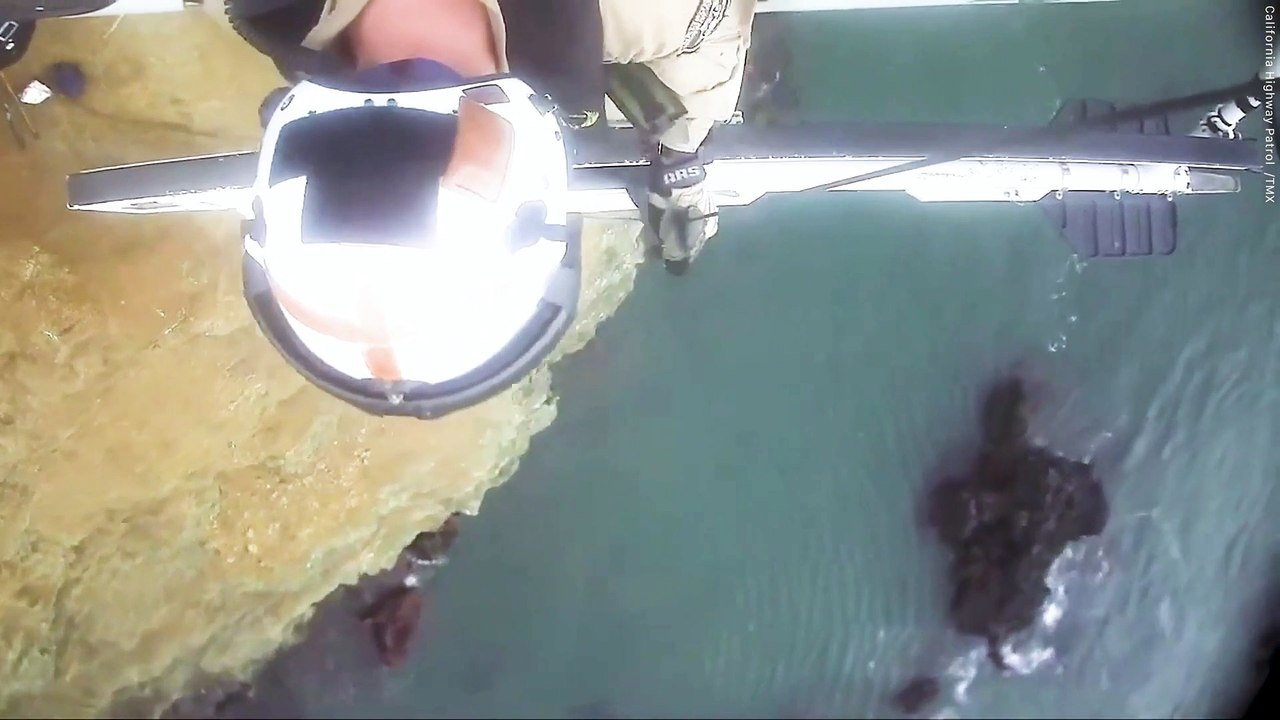 Dramatic moment helicopter rescue two people stranded on cliff edge in California
