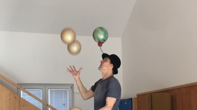 'That's unbelievable!' - Juglar impressively juggles 5 balls balancing atop 3 Rola-bola while spining a ball on hat