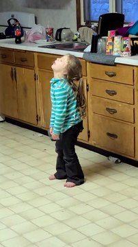 Tired Three-Year-Old Falls Asleep Standing Up