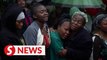 Malawi buries storm victims in flooded graves