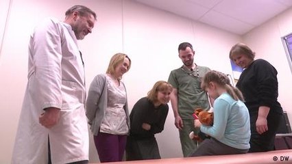Wounded Ukraine girl relearns to walk one step at a time
