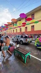 Spray Foam Flies Freely at a Carnival Parade in Ecuador