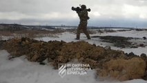 Ukrainian soldiers fire at Russian positions with rocket launchers and heavy machine guns