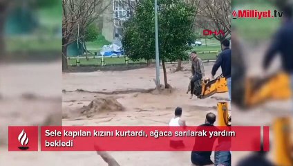 Sele kapılan kızını kurtardı, ağaca sarılarak yardım bekledi