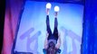 Circus Performer Juggles Rollers on Her Feet While Lying on Her Back
