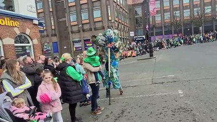 A recycling giant slinking through the Diamond on St Patrick's Day