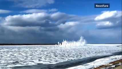 Water propelled sky-high as workers blow up frozen river
