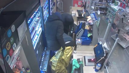 Gang of balaclava-clad men armed with crowbars steal more than £3,000 from Surrey Co-op