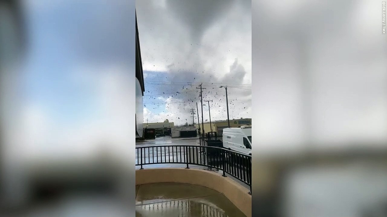Moment rare TORNADO lifts debris in swirling funnel southeast of Los Angeles