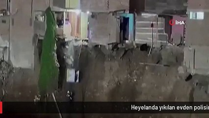 Heyelanda yıkılan evden polisin üzerine derin dondurucu düştü