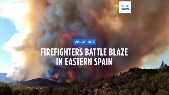 Firefighters fight raging wildfires blazing through forests in eastern Spain