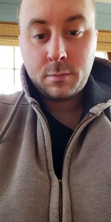 Cat Zips Up Man's Jacket