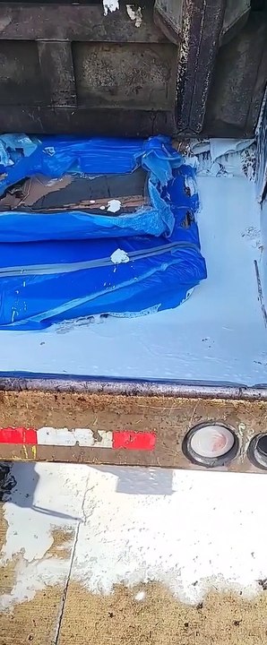 Gallons of Paint Spill Out of Garbage Truck