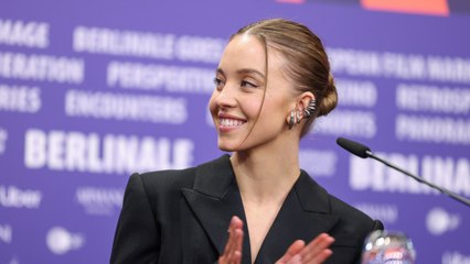 Sydney Sweeney Sported Baggy Blue Jeans and a Two Piece Tube Top During Her First Football