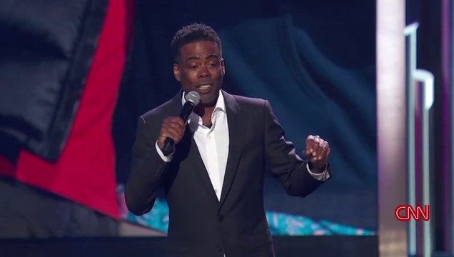 chris-rock-jokes-about-the-oscars-slap-in-tribute-to-adam-sandler