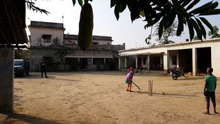 Indian Woman playing cricket in Rural India