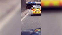 Cops slammed after biker pulls death-defying wheelies in full view of a police car