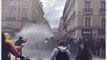 Pension-Reform Protesters Use Umbrellas to Deflect Police Water Cannon in Rennes