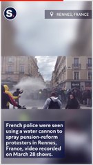 Pension-Reform Protesters Use Umbrellas to Deflect Police Water Cannon in Rennes