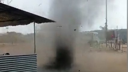 Watch the shocking moment workers flee a 200ft tornado in India