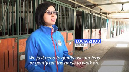 Beijing kids with autism get help from horses
