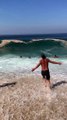 Large Waves Wash Over Beachgoers in Brazil