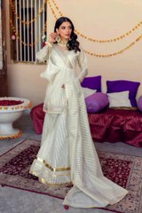 white colored short shirt is heavily worked with tilla and sequence work and it is paired with a woven organza gharara