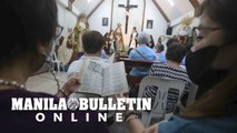 Filipino catholic devotees sing verses during a 'Pabasa'