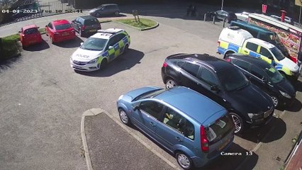 CCTV shows six cops storm a pub and seize golliwog dolls after a hate crime complaint