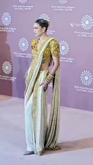 Gigi Hadid Shines in an Ornate Golden Saree at NMACC Gala event
