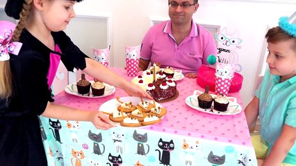 Diana and Roma celebrate their cat's birthday