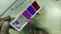 Mixing glitter eyeshadow and lipstick in to the clear slime.