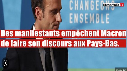 Des manifestants interrompent Macron lors d'un événement international.