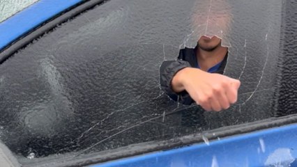 Man fearlessly punches through his car window... but not really! *Ice Storm Aftermath*