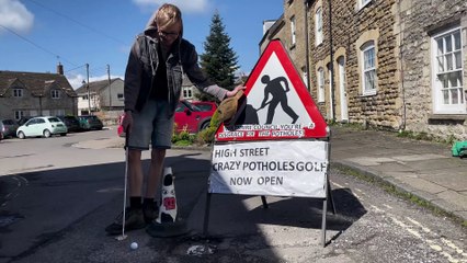 My road's potholes got so bad I set up a crazy golf course on my street