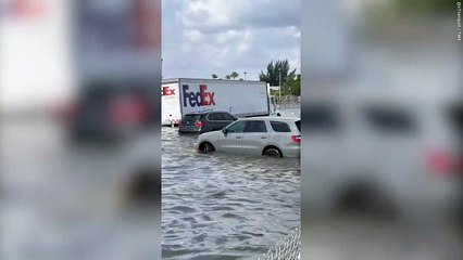 Videos shows vehicles almost completely submerged in floodwaters at Fort Lauderdale Airport