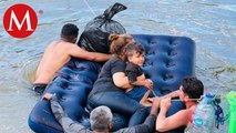 Migrantes cruzan el Río Bravo con menores en colchones inflables; Tamaulipas