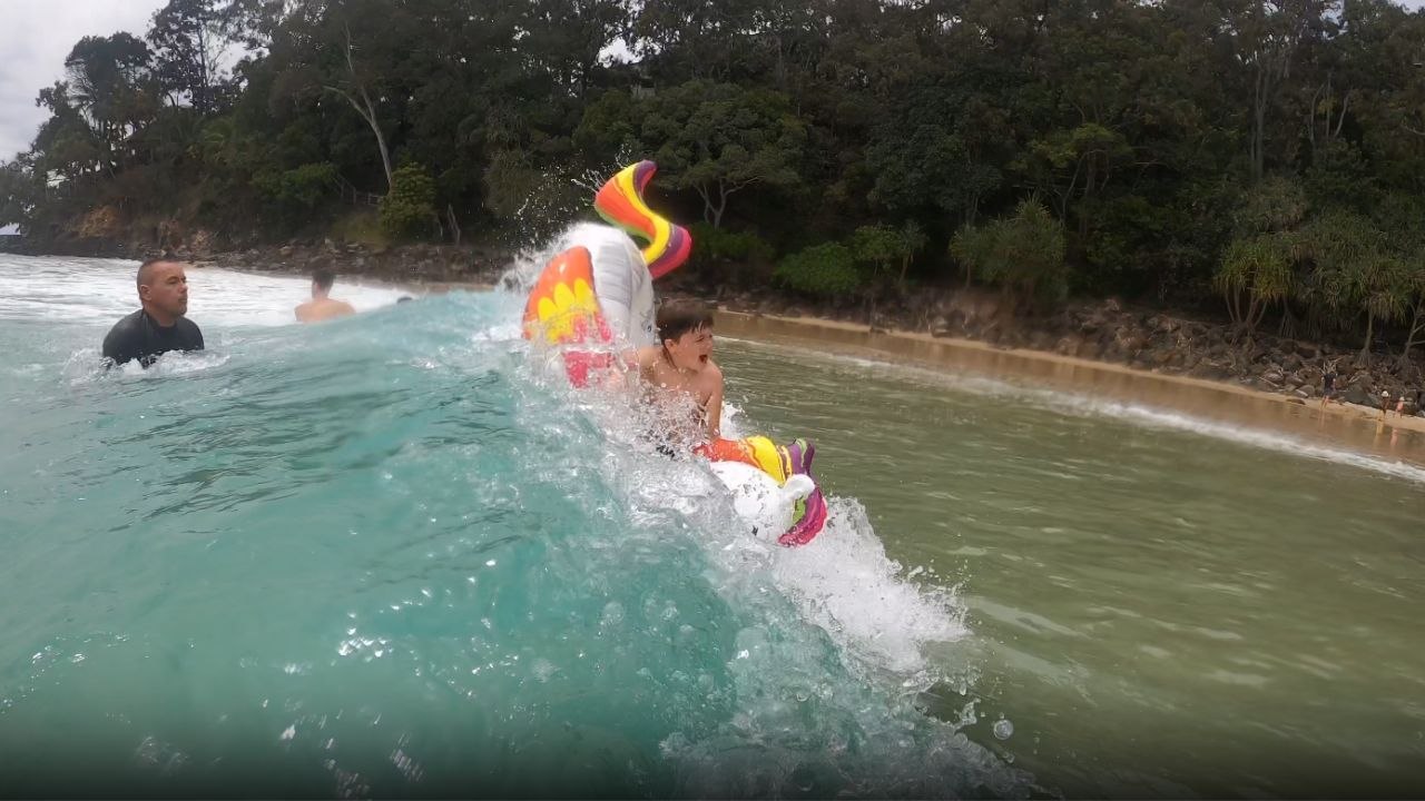 Boy experiences EPIC surfing WIPEOUT despite having the lucky charm of a unicorn