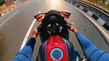 'CLOSE CALL!' - Risk-taking biker speeds through extremely narrow gap between 2 trucks