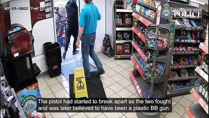 Watch moment have-a-go hero shop worker tackled armed robber