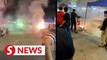Impromptu fireworks display triggered by fire at unlicensed night market stall