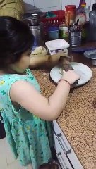 Mayra making Chapati