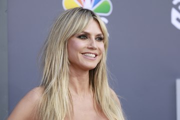 Heidi Klum Paired Her Itty-Bitty Yellow Bikini With a Furry Bucket Hat