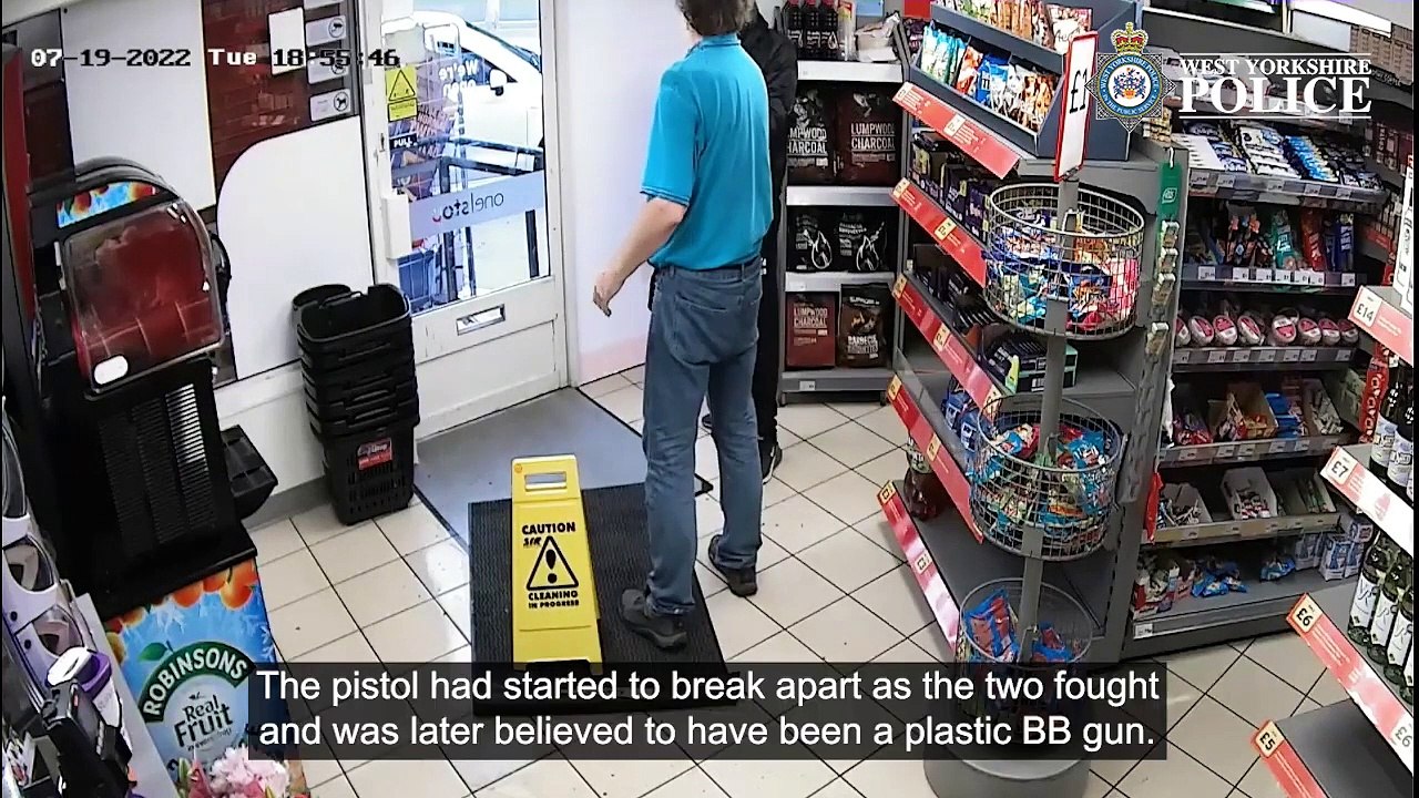 Have-a-go-hero shop worker tackless gun-wielding robber