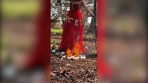 Woman celebrates her divorce by burning her wedding dress